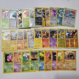 140+ Pokemon Cards including 20+ holo cards, 20+ energy cards, and more